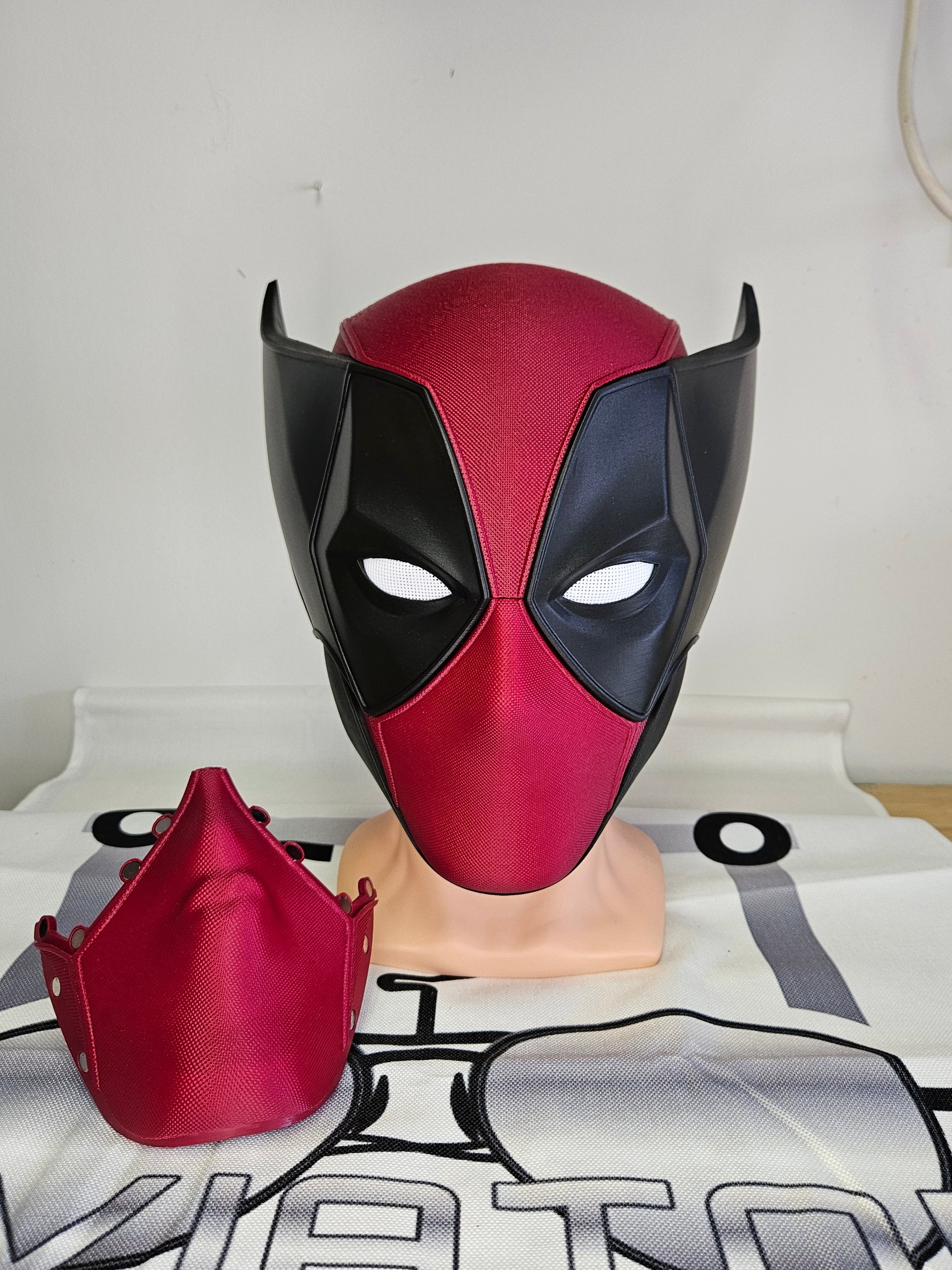 Deadpool and Wolverine mash up helmet. 3D Printed Poolverine cosplay prop by Aviator 3D Printing. Treat yourself or gift to a special person. Great for home office display, or to wear anytime. Get yours before the next Marvel Deadpool and Wolverine movie.