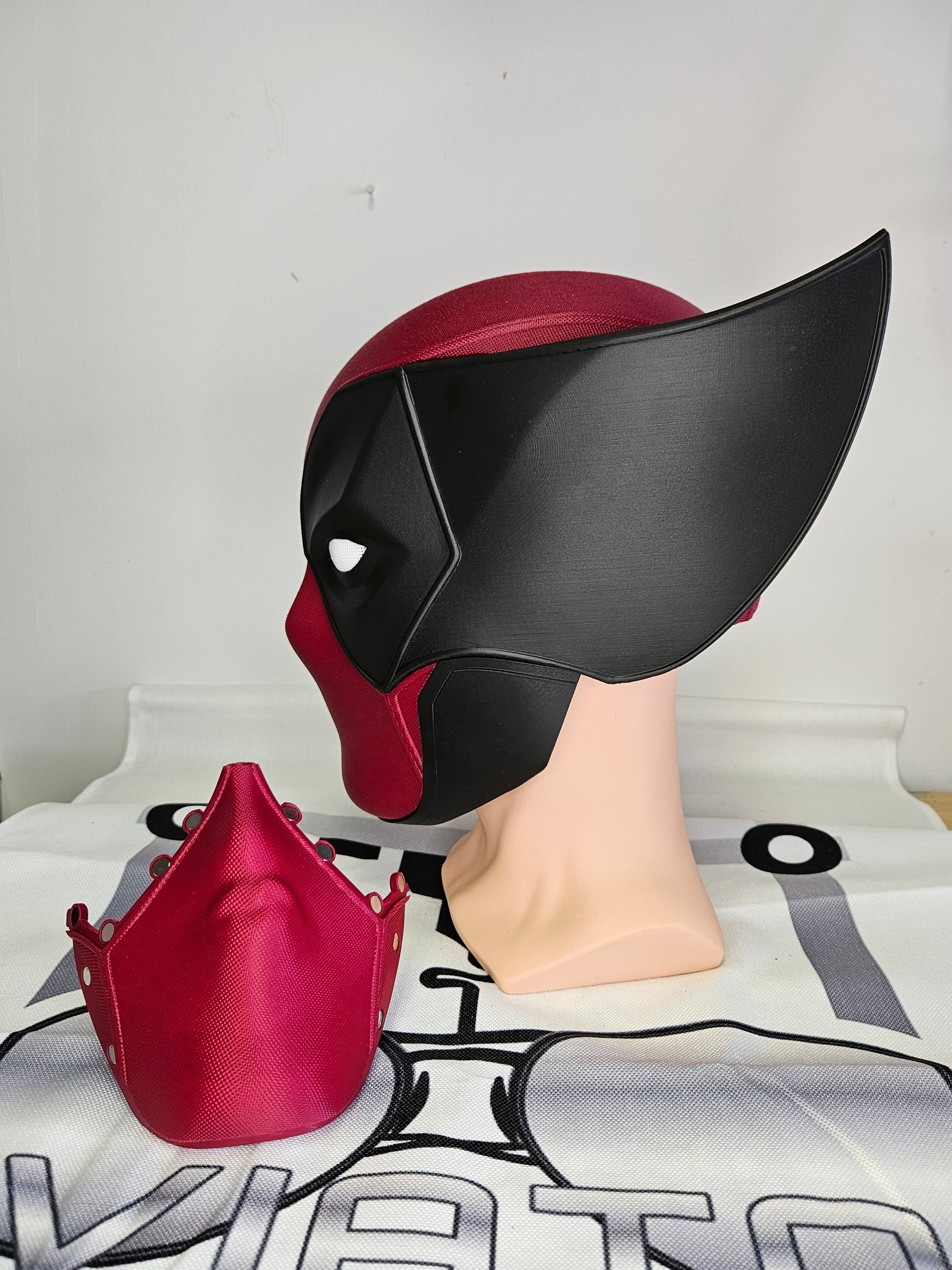 Deadpool and Wolverine mash up helmet. 3D Printed Poolverine cosplay prop by Aviator 3D Printing. Treat yourself or gift to a special person. Great for home office display, or to wear anytime. Get yours before the next Marvel Deadpool and Wolverine movie.