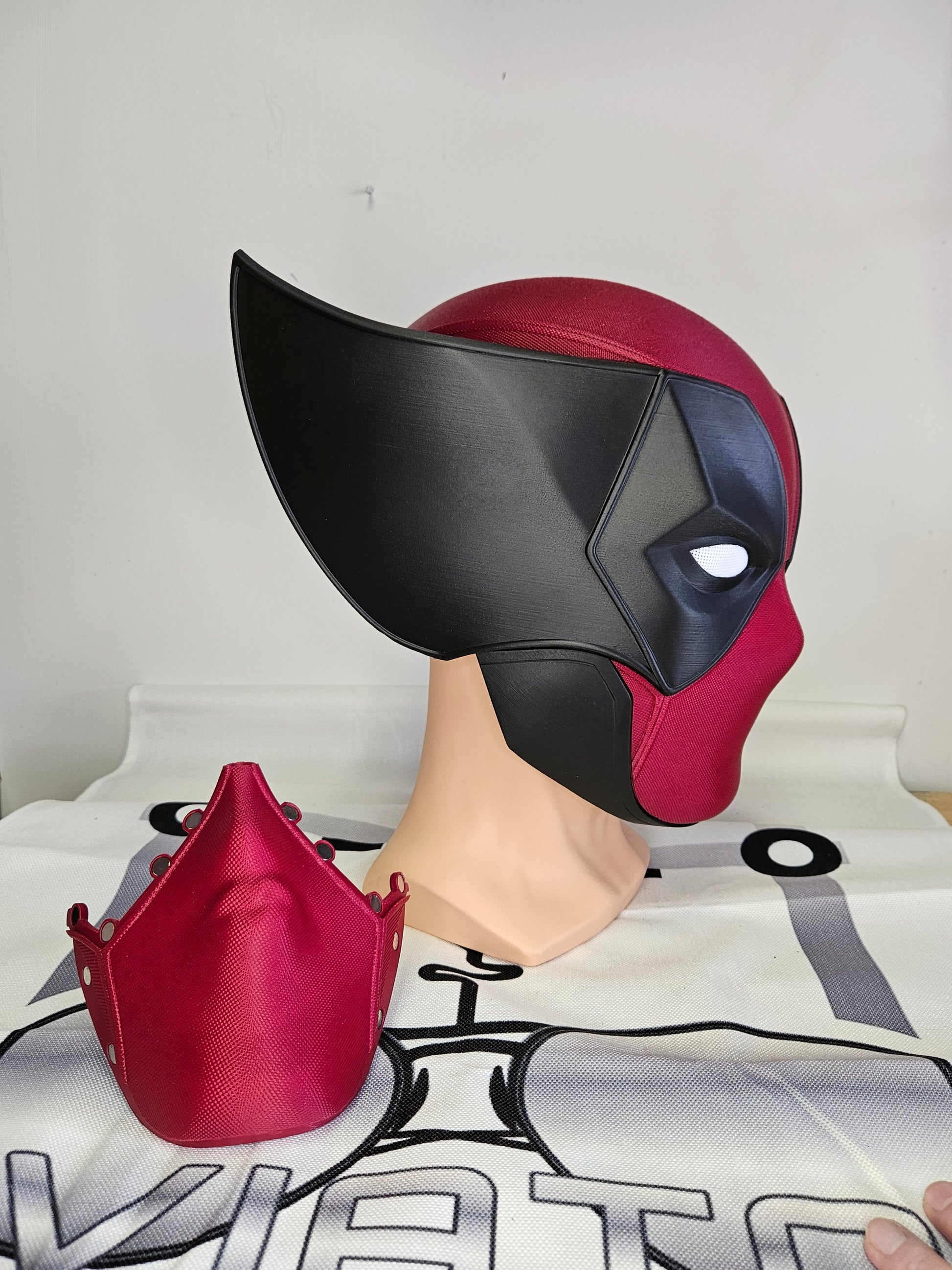 Deadpool and Wolverine mash up helmet. 3D Printed Poolverine cosplay prop by Aviator 3D Printing. Treat yourself or gift to a special person. Great for home office display, or to wear anytime. Get yours before the next Marvel Deadpool and Wolverine movie.