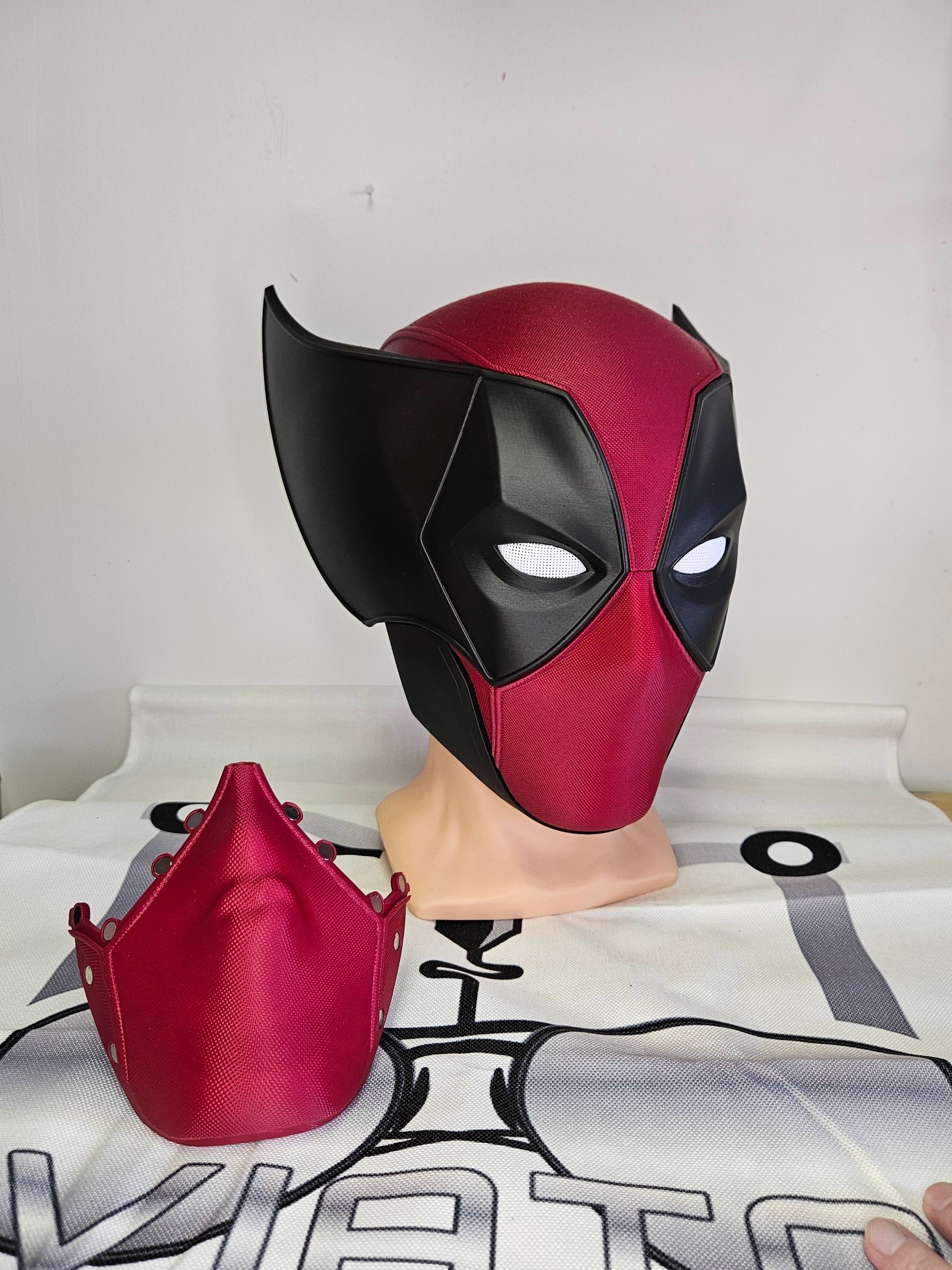 Deadpool and Wolverine mash up helmet. 3D Printed Poolverine cosplay prop by Aviator 3D Printing. Treat yourself or gift to a special person. Great for home office display, or to wear anytime. Get yours before the next Marvel Deadpool and Wolverine movie.