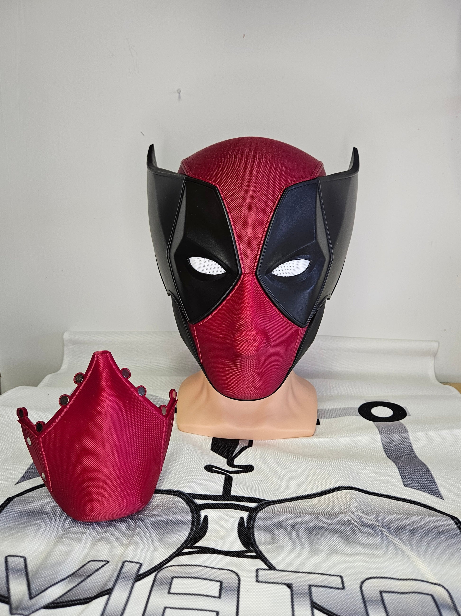 Deadpool and Wolverine mash up helmet. 3D Printed Poolverine cosplay prop by Aviator 3D Printing. Treat yourself or gift to a special person. Great for home office display, or to wear anytime. Get yours before the next Marvel Deadpool and Wolverine movie.