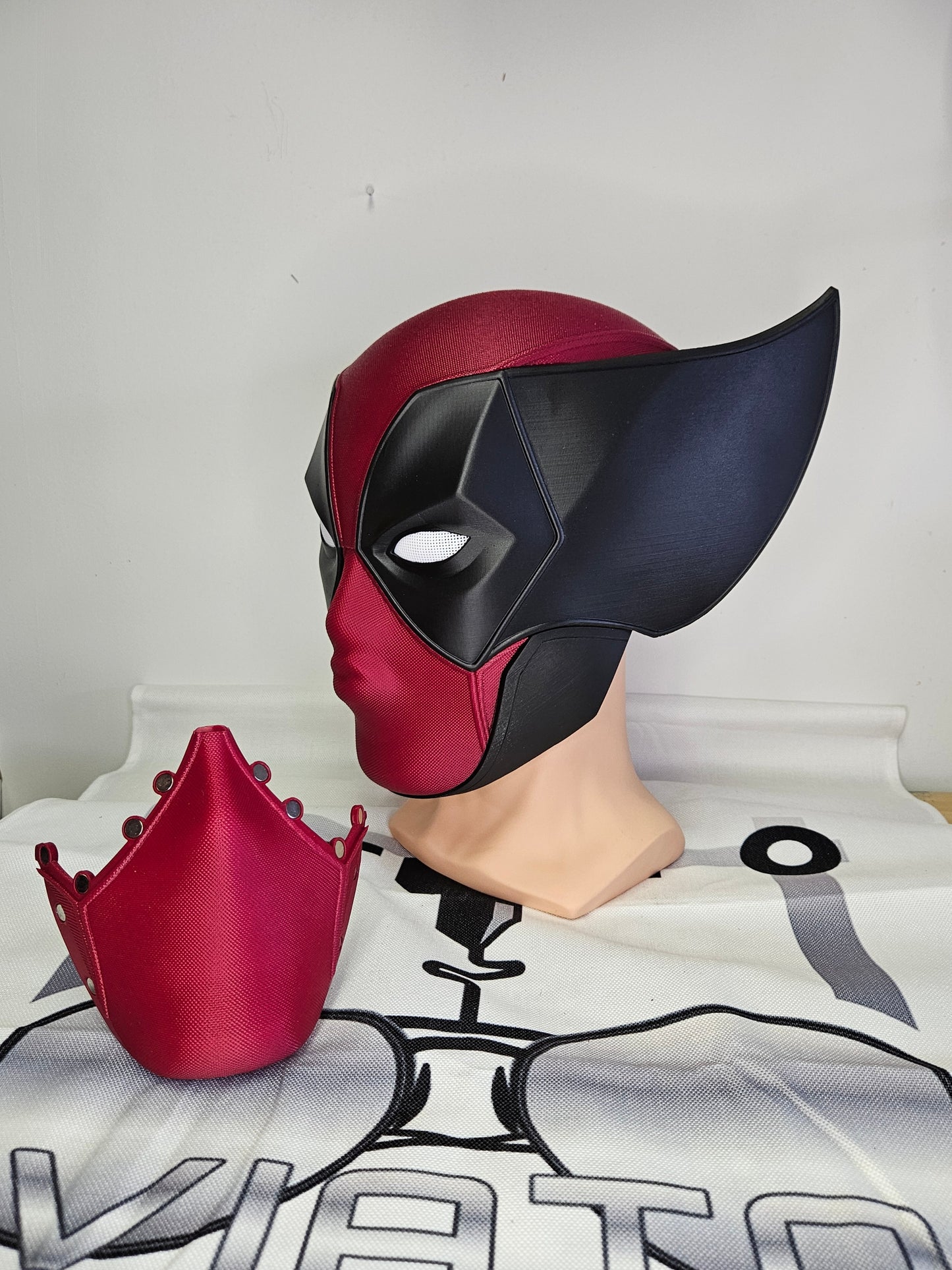 Deadpool and Wolverine mash up helmet. 3D Printed Poolverine cosplay prop by Aviator 3D Printing. Treat yourself or gift to a special person. Great for home office display, or to wear anytime. Get yours before the next Marvel Deadpool and Wolverine movie.