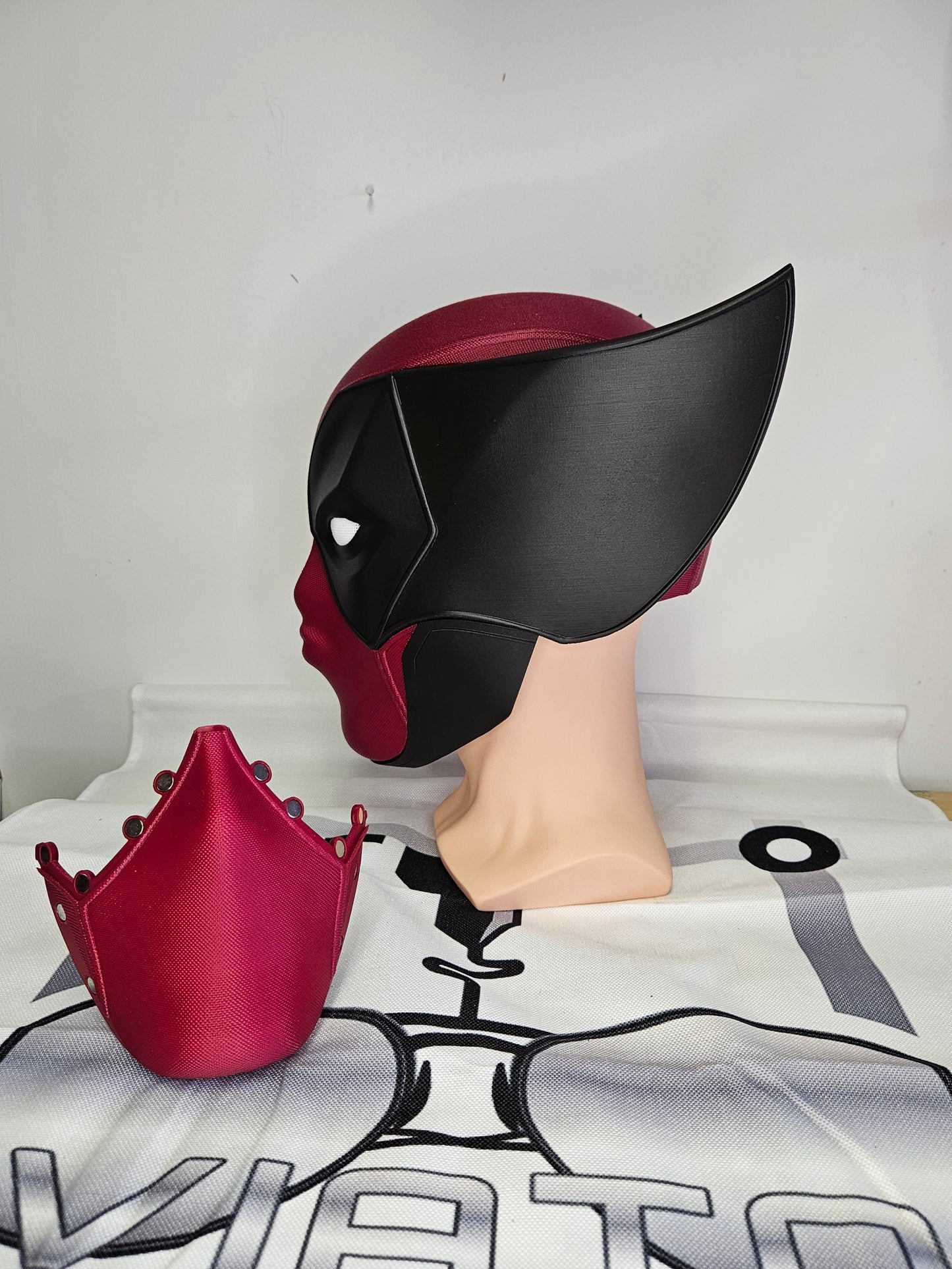 Deadpool and Wolverine mash up helmet. 3D Printed Poolverine cosplay prop by Aviator 3D Printing. Treat yourself or gift to a special person. Great for home office display, or to wear anytime. Get yours before the next Marvel Deadpool and Wolverine movie.