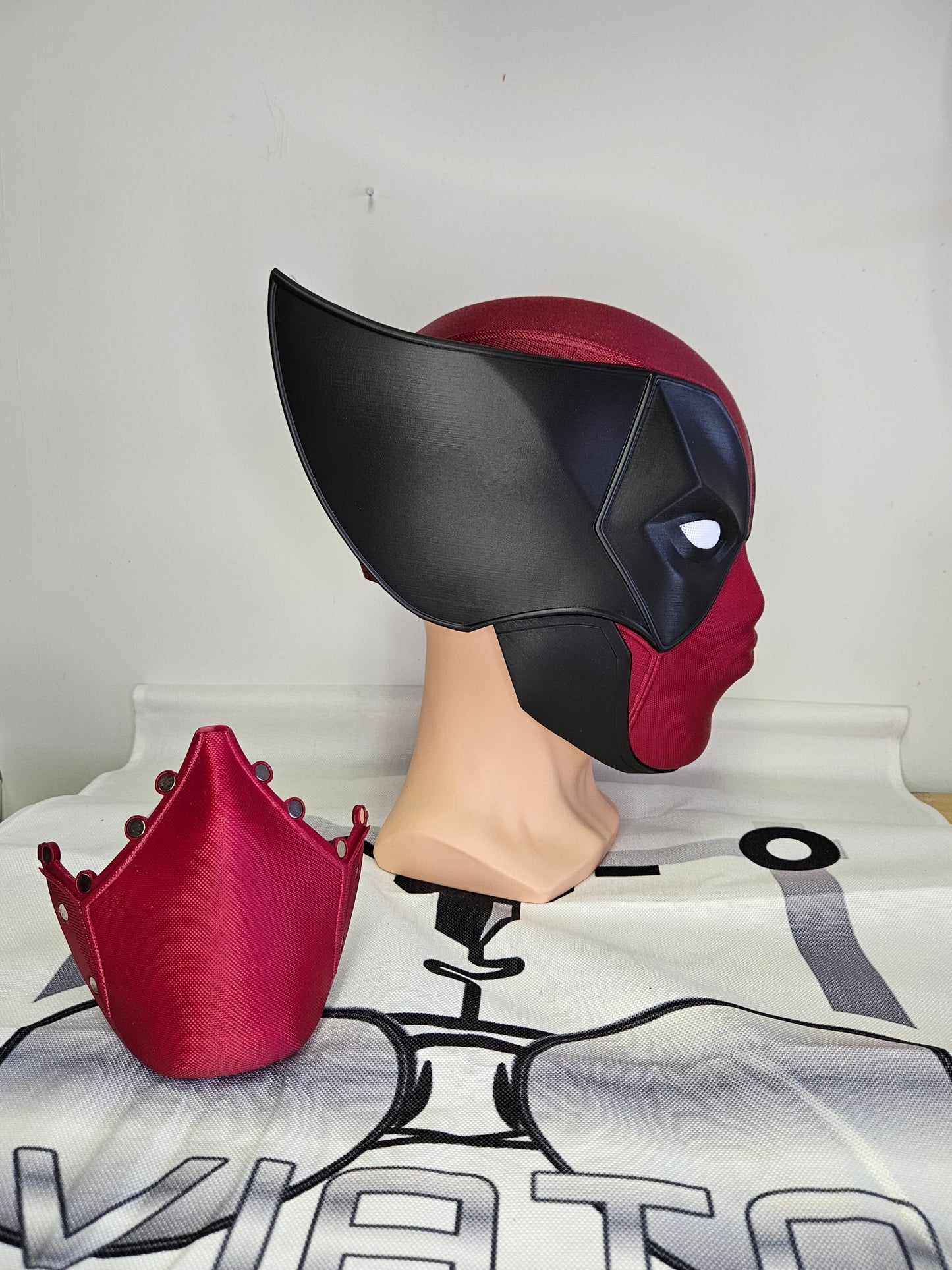 Deadpool and Wolverine mash up helmet. 3D Printed Poolverine cosplay prop by Aviator 3D Printing. Treat yourself or gift to a special person. Great for home office display, or to wear anytime. Get yours before the next Marvel Deadpool and Wolverine movie.
