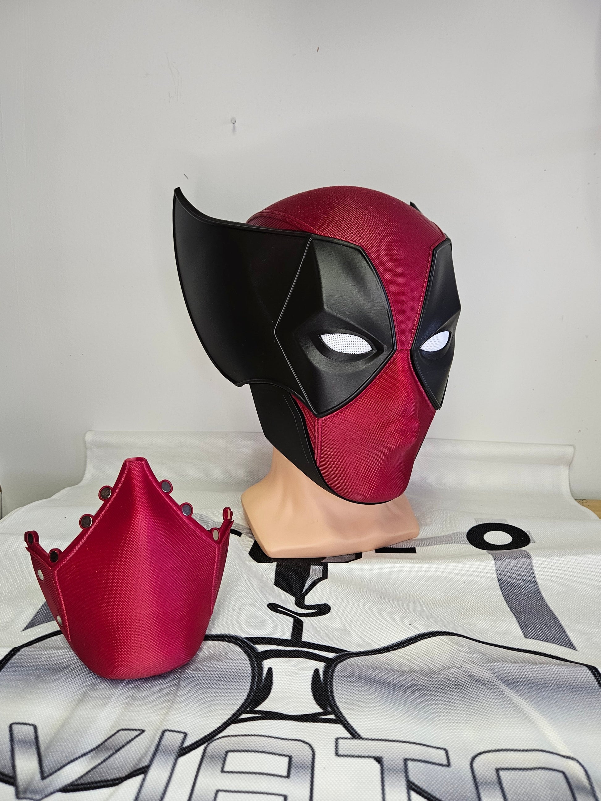 Deadpool and Wolverine mash up helmet. 3D Printed Poolverine cosplay prop by Aviator 3D Printing. Treat yourself or gift to a special person. Great for home office display, or to wear anytime. Get yours before the next Marvel Deadpool and Wolverine movie.