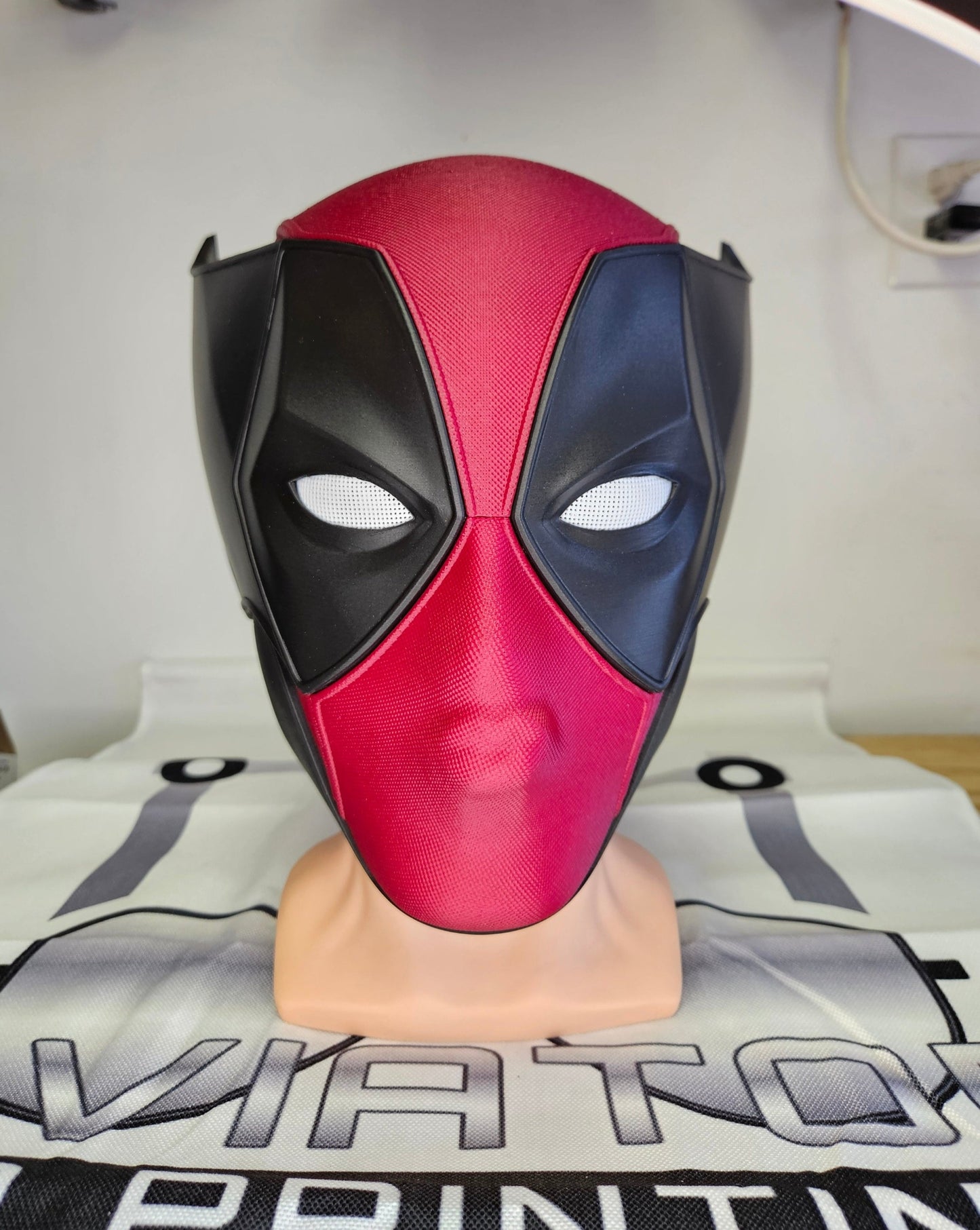 Deadpool and Wolverine mash up helmet. 3D Printed Poolverine cosplay prop by Aviator 3D Printing. Treat yourself or gift to a special person. Great for home office display, or to wear anytime. Get yours before the next Marvel Deadpool and Wolverine movie.