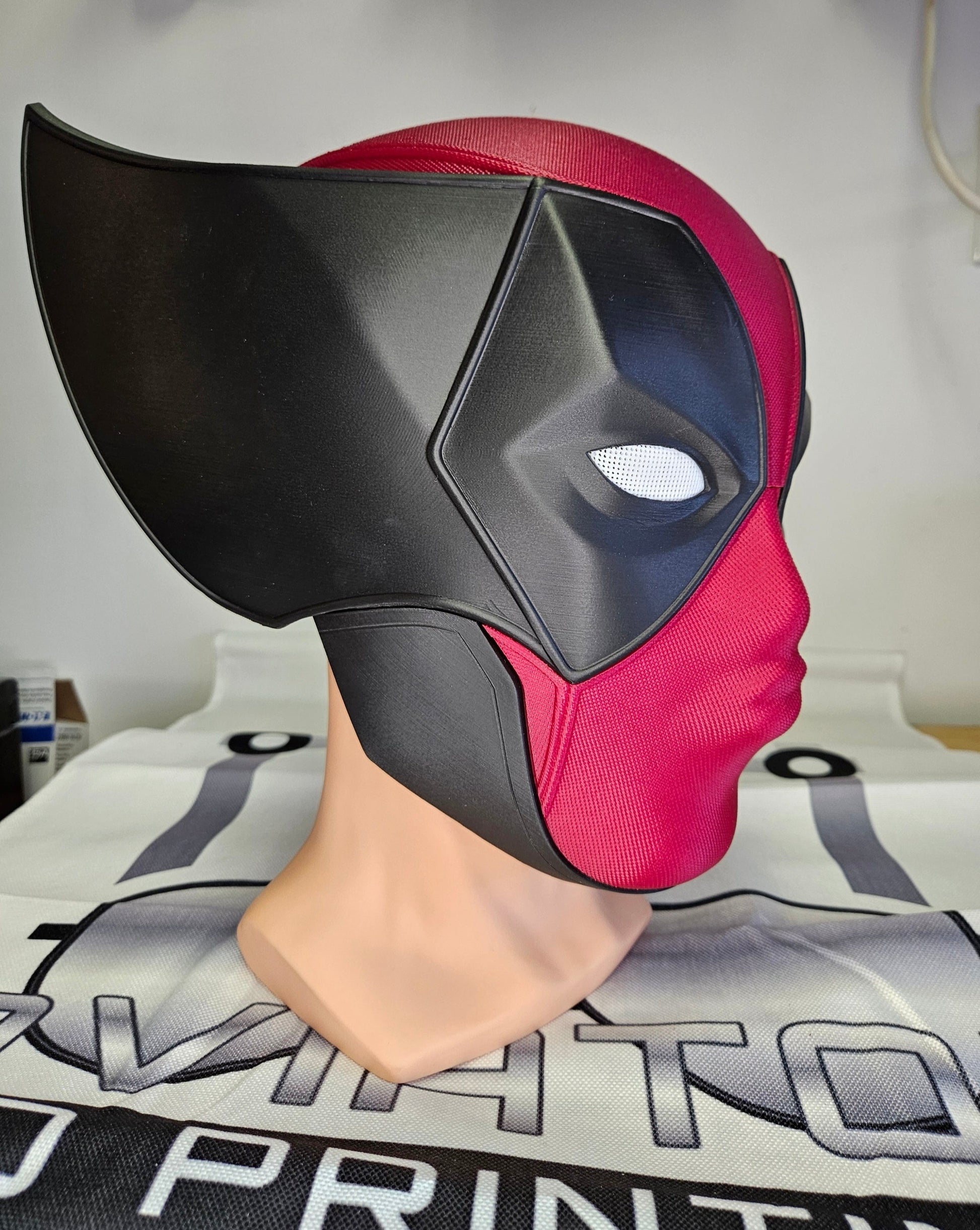 Deadpool and Wolverine mash up helmet. 3D Printed Poolverine cosplay prop by Aviator 3D Printing. Treat yourself or gift to a special person. Great for home office display, or to wear anytime. Get yours before the next Marvel Deadpool and Wolverine movie.