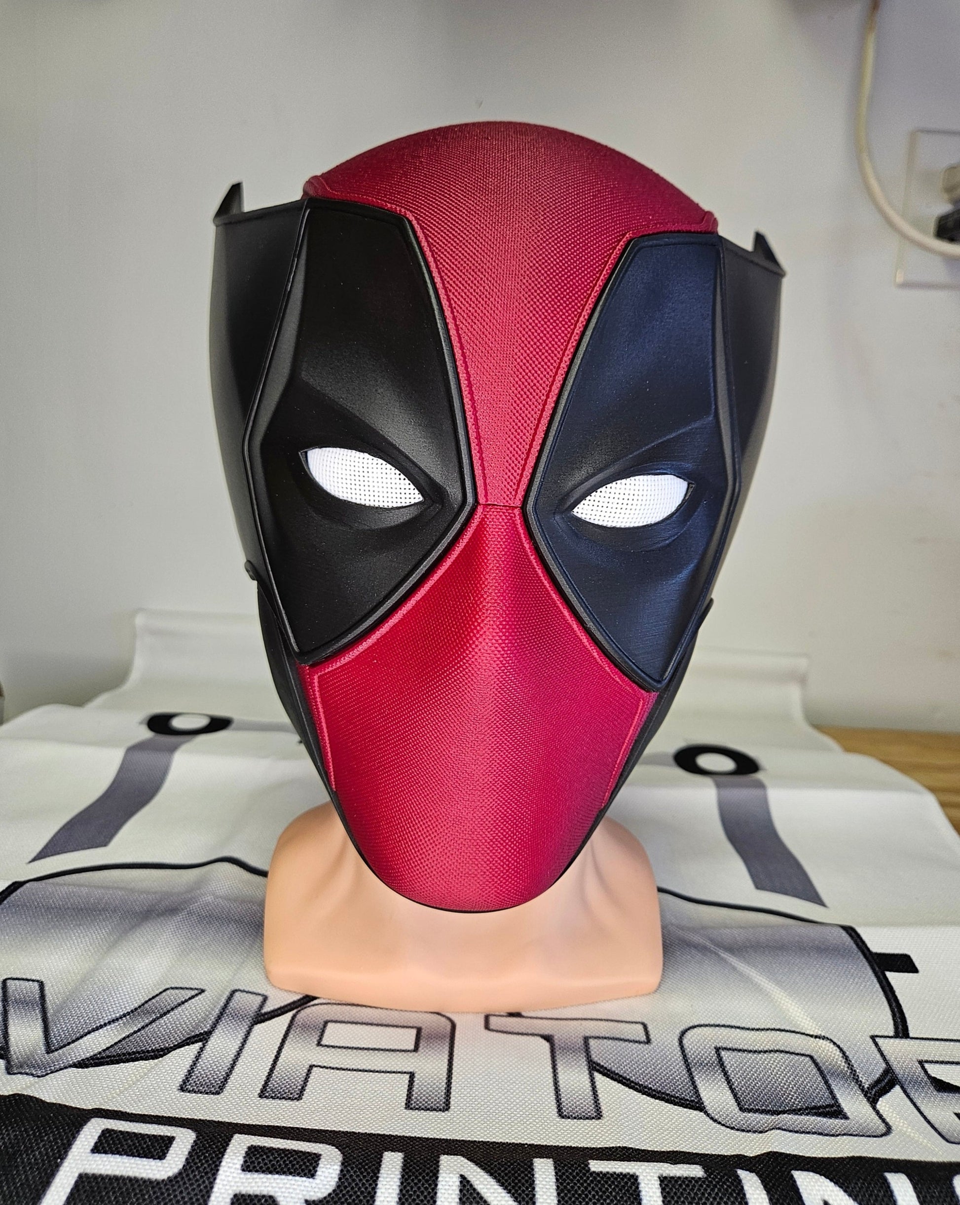 Deadpool and Wolverine mash up helmet. 3D Printed Poolverine cosplay prop by Aviator 3D Printing. Treat yourself or gift to a special person. Great for home office display, or to wear anytime. Get yours before the next Marvel Deadpool and Wolverine movie.