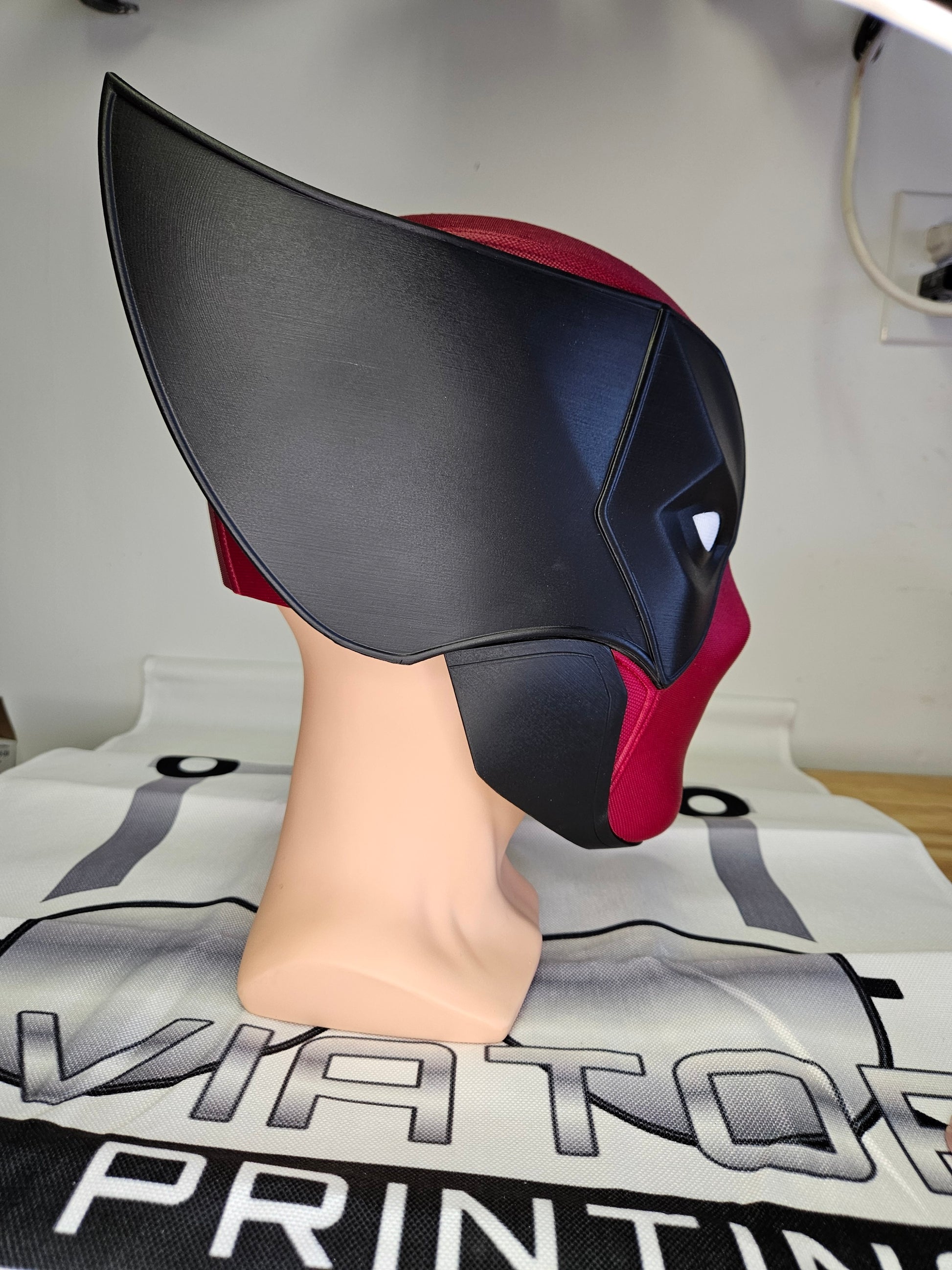 Deadpool and Wolverine mash up helmet. 3D Printed Poolverine cosplay prop by Aviator 3D Printing. Treat yourself or gift to a special person. Great for home office display, or to wear anytime. Get yours before the next Marvel Deadpool and Wolverine movie.