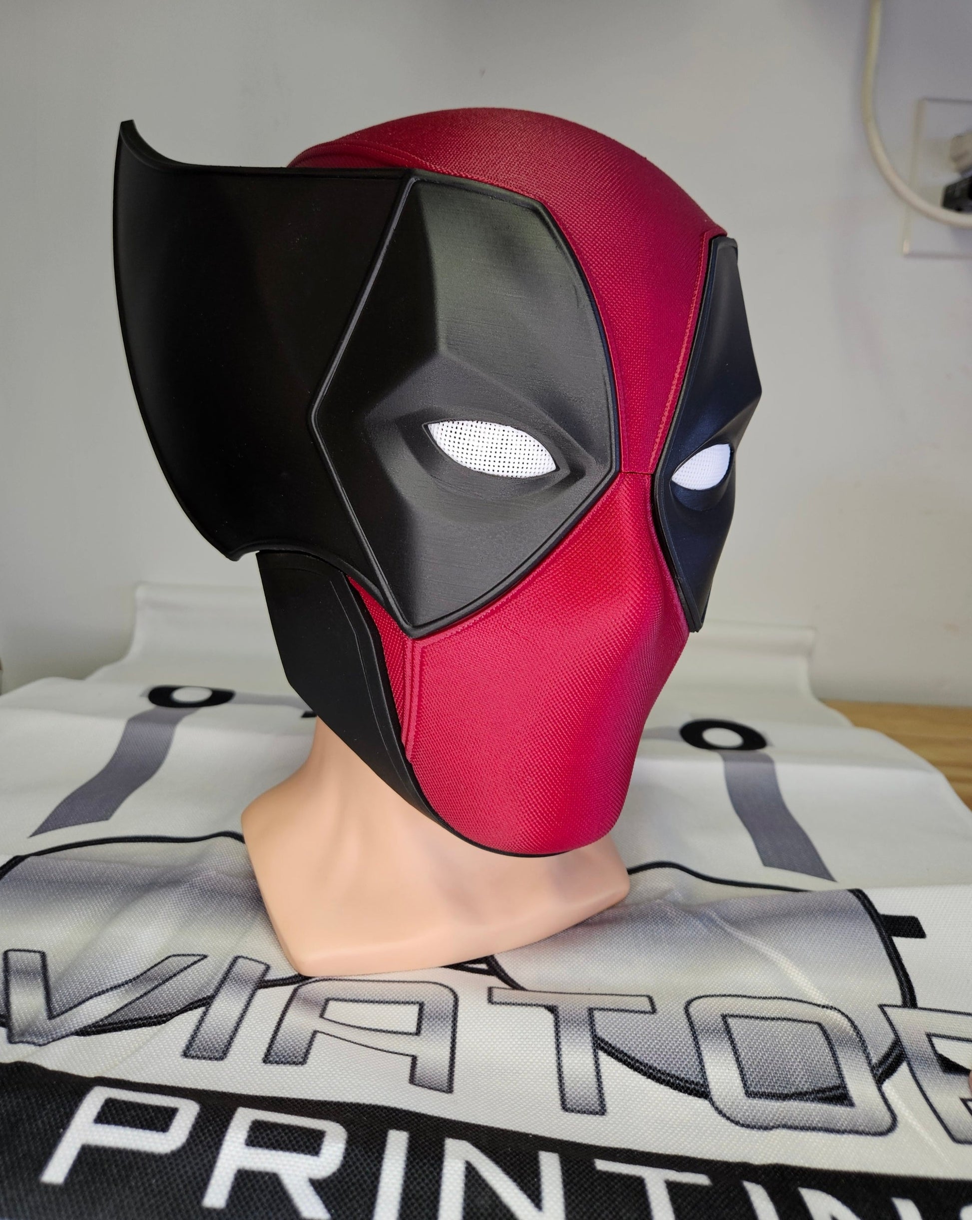 Deadpool and Wolverine mash up helmet. 3D Printed Poolverine cosplay prop by Aviator 3D Printing. Treat yourself or gift to a special person. Great for home office display, or to wear anytime. Get yours before the next Marvel Deadpool and Wolverine movie.
