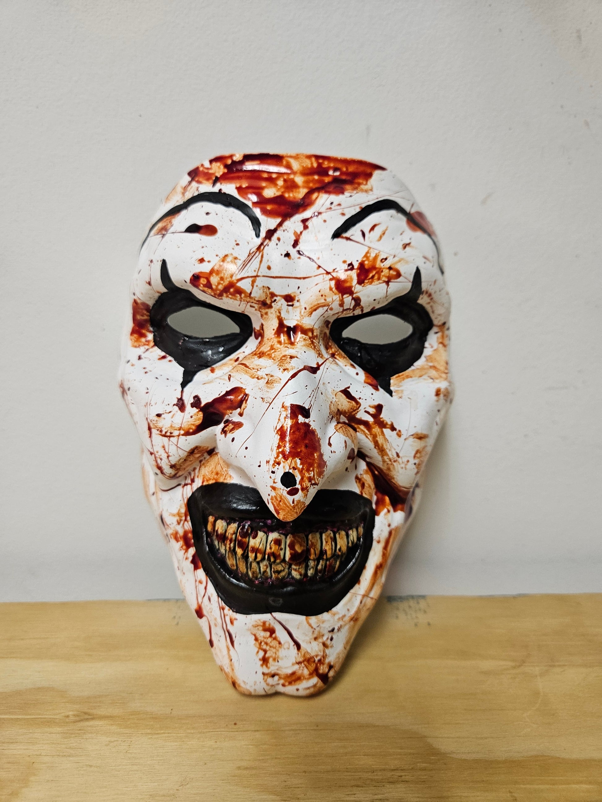 Art the clown from the Terrifier movie mask is 3D printed, painted and accented in realistic FAKE blood paint or without. Available now from Aviator 3D Printing .com