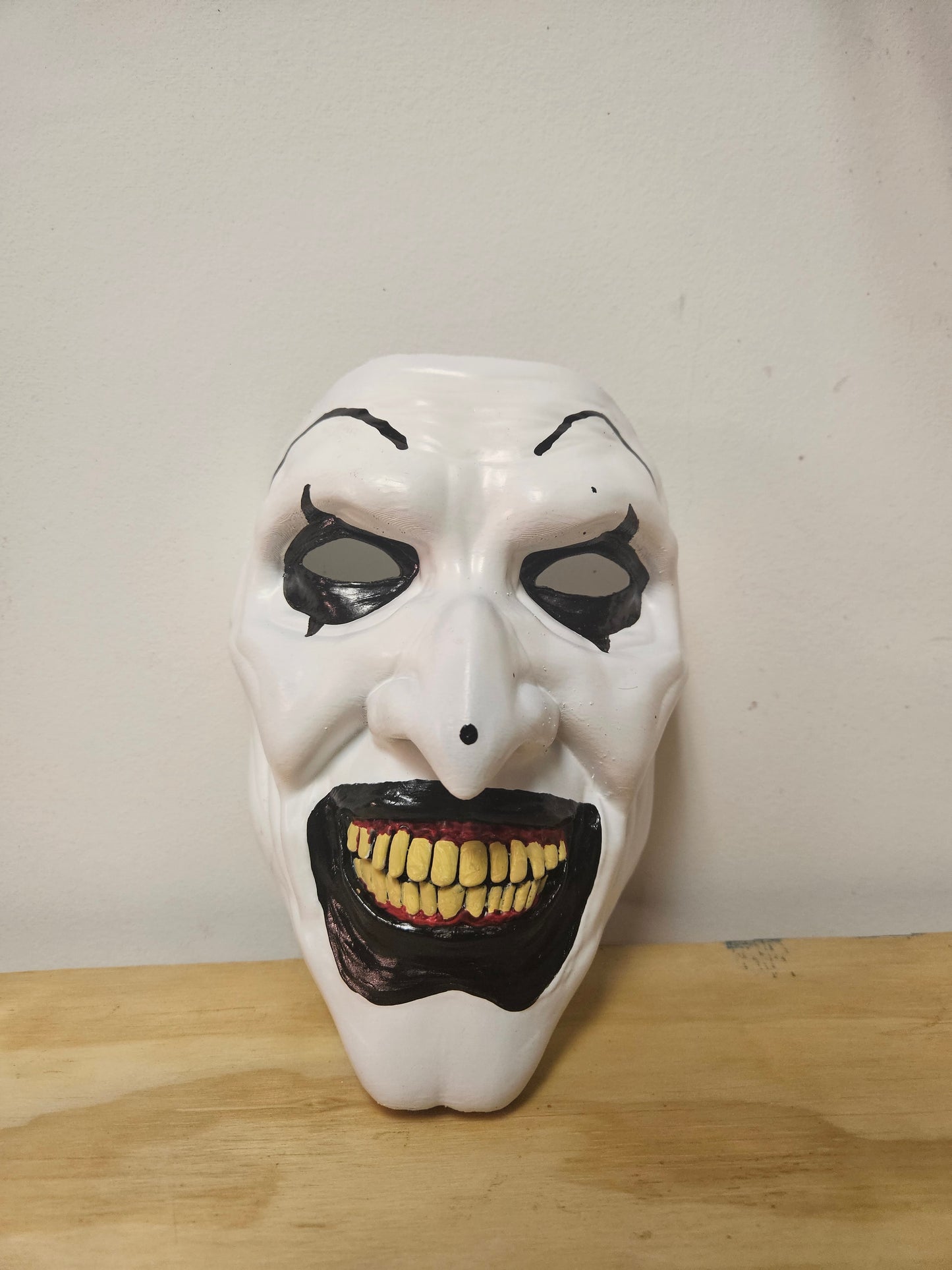 Art the clown from the Terrifier movie mask is 3D printed, painted and accented in realistic FAKE blood paint or without. Available now from Aviator 3D Printing .com